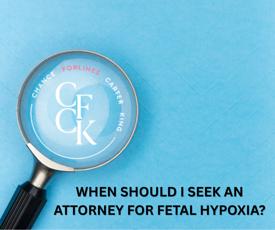 CFCK Law Firm | Atlanta, GA | Blog | Fetal Hypoxia Birth Injury 3 | Picture with a blue fabric background, and a magnifying glass with CFCK logo in the middle of the looking glass and text to the right that says: "When Should I Seek an Attorney for Fetal Hypoxia"